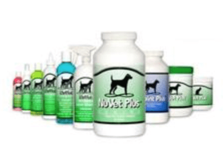 A group of bottles and jars with different dog products.